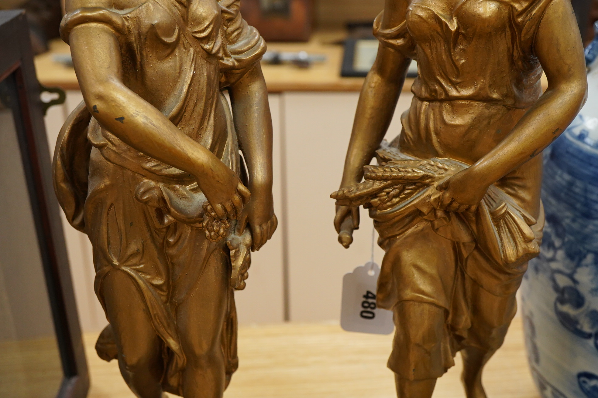 A pair of late 19th century gold-painted spelter figures, 48cm